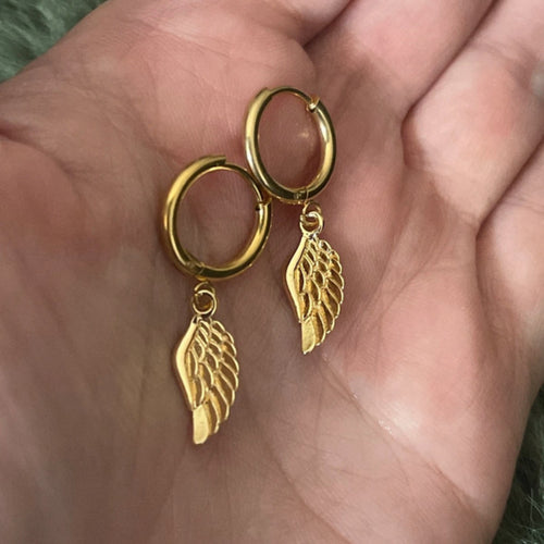 Gold hoop earrings with a gold Angel wing.