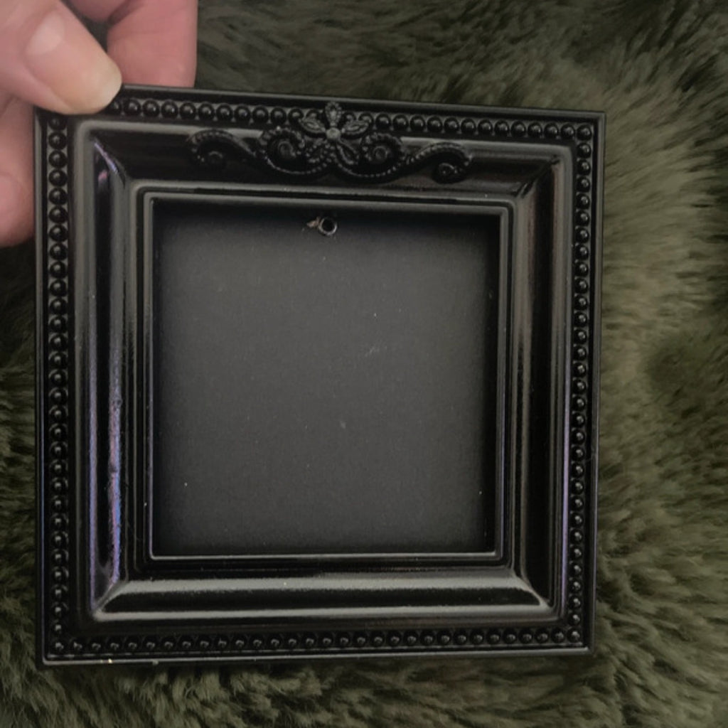 Black gothic square picture frame.