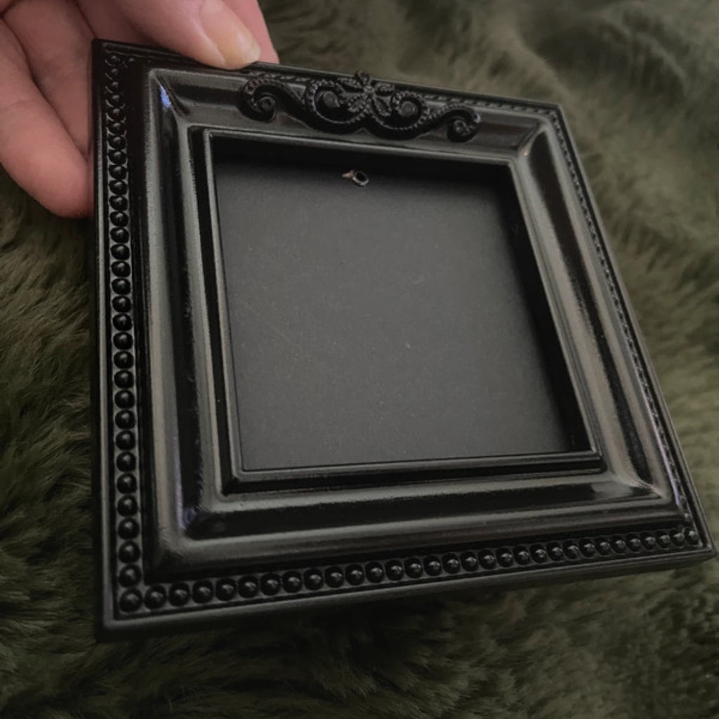 Black gothic square picture frame.