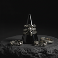 Black crystal ring holder with rings on a dark background 