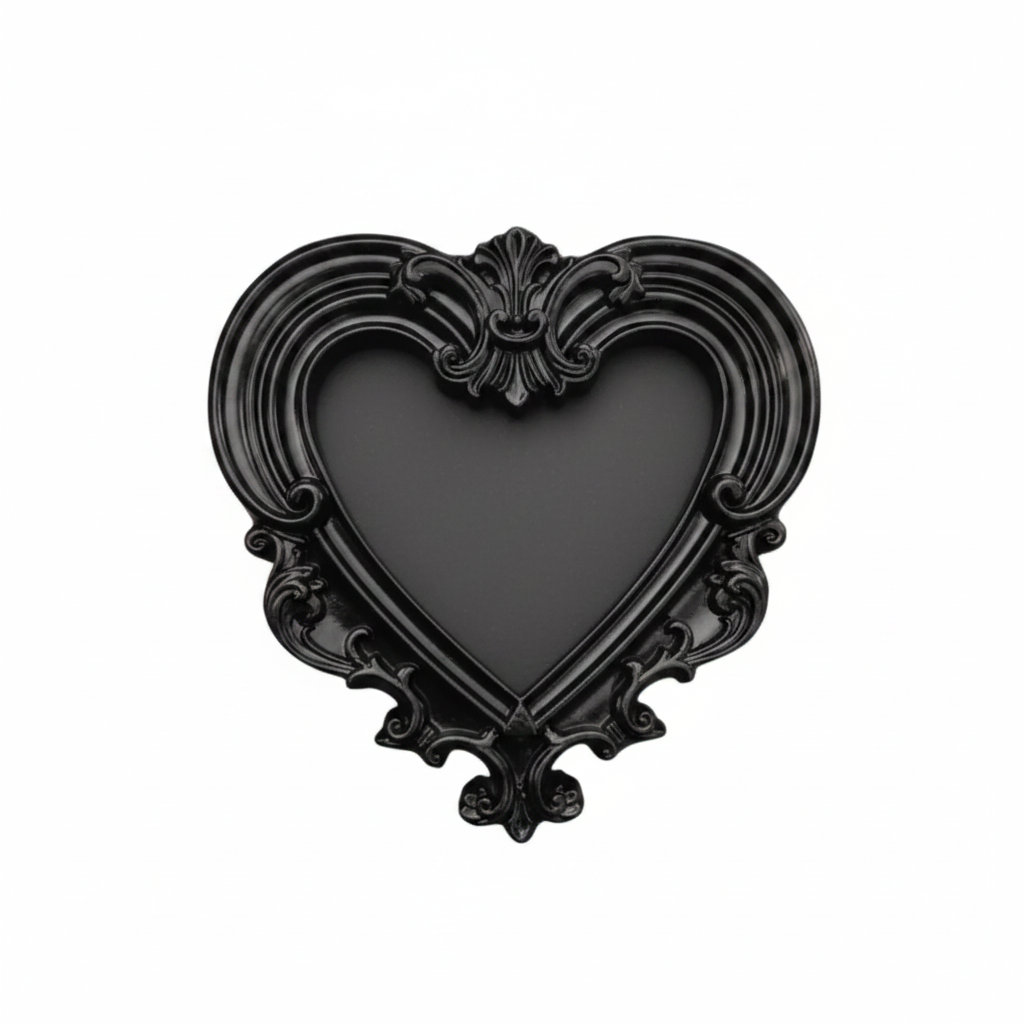 A black heart-shaped decorative frame with an ornate baroque-style scrollwork border, shown against a plain white background.