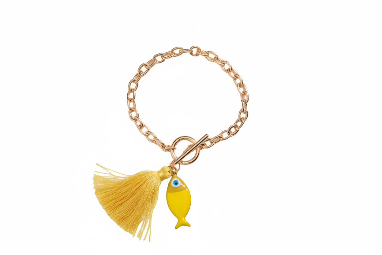 gold chunky bracelet with a yellow fish and yellow tassel on a white background 