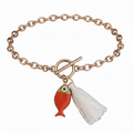 Gol bracelet with an orange fish and a white tassel on a white background.