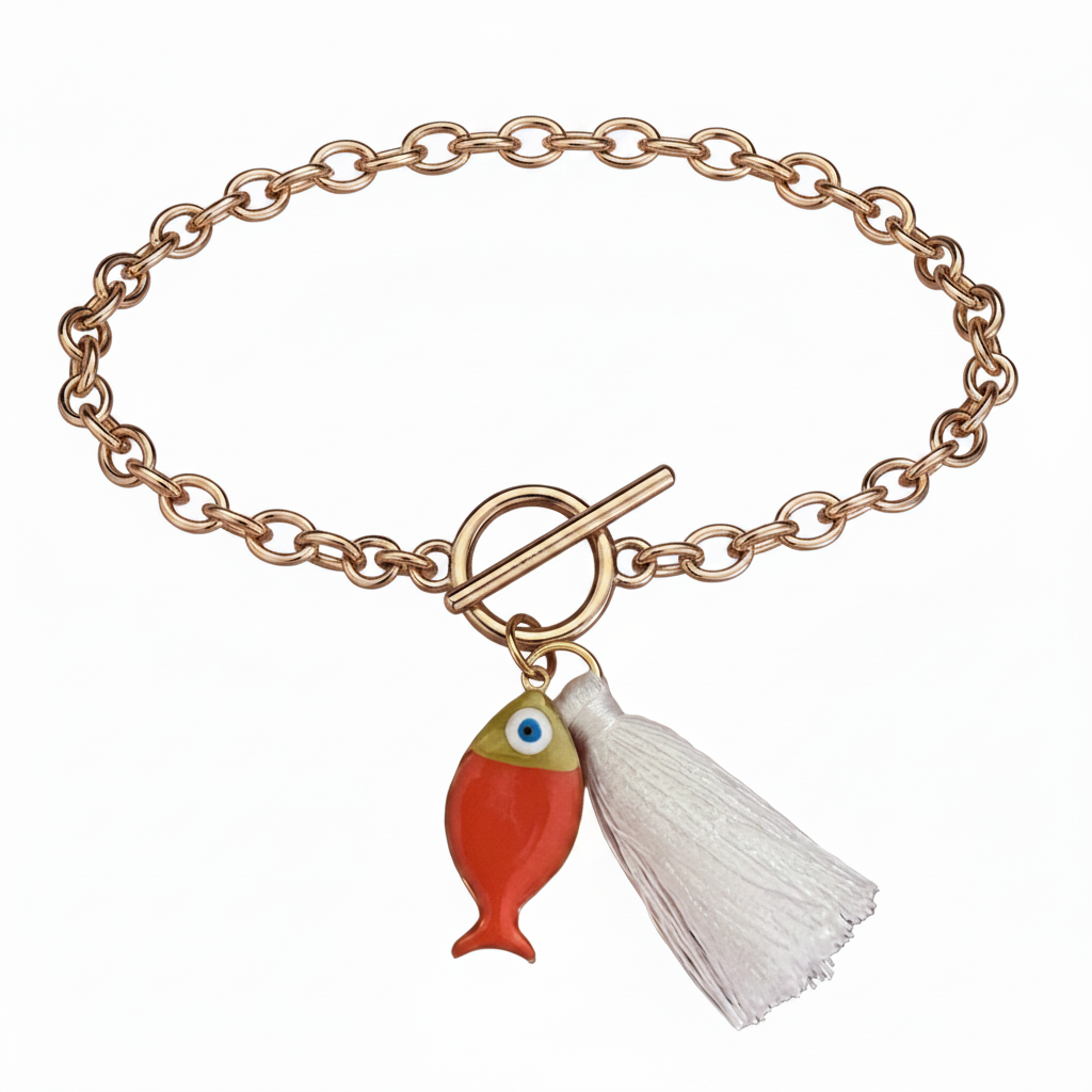 Gol bracelet with an orange fish and a white tassel on a white background.