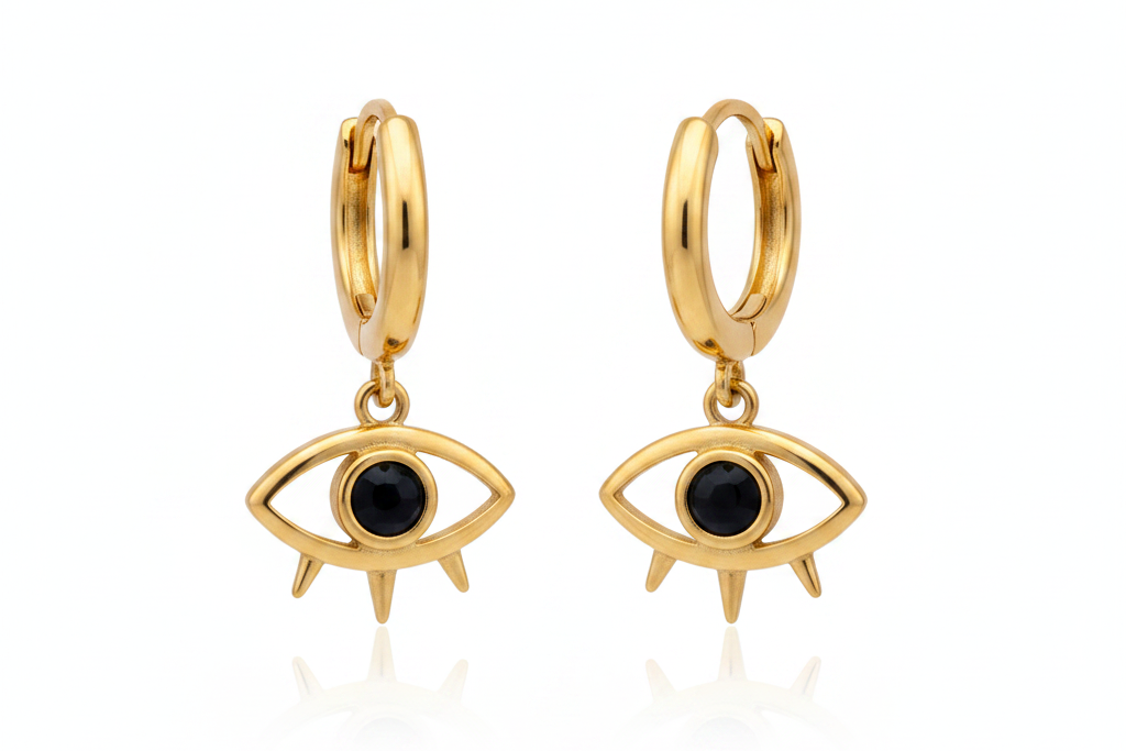 Gold hoop earrings with eye-shaped charms on a white background
