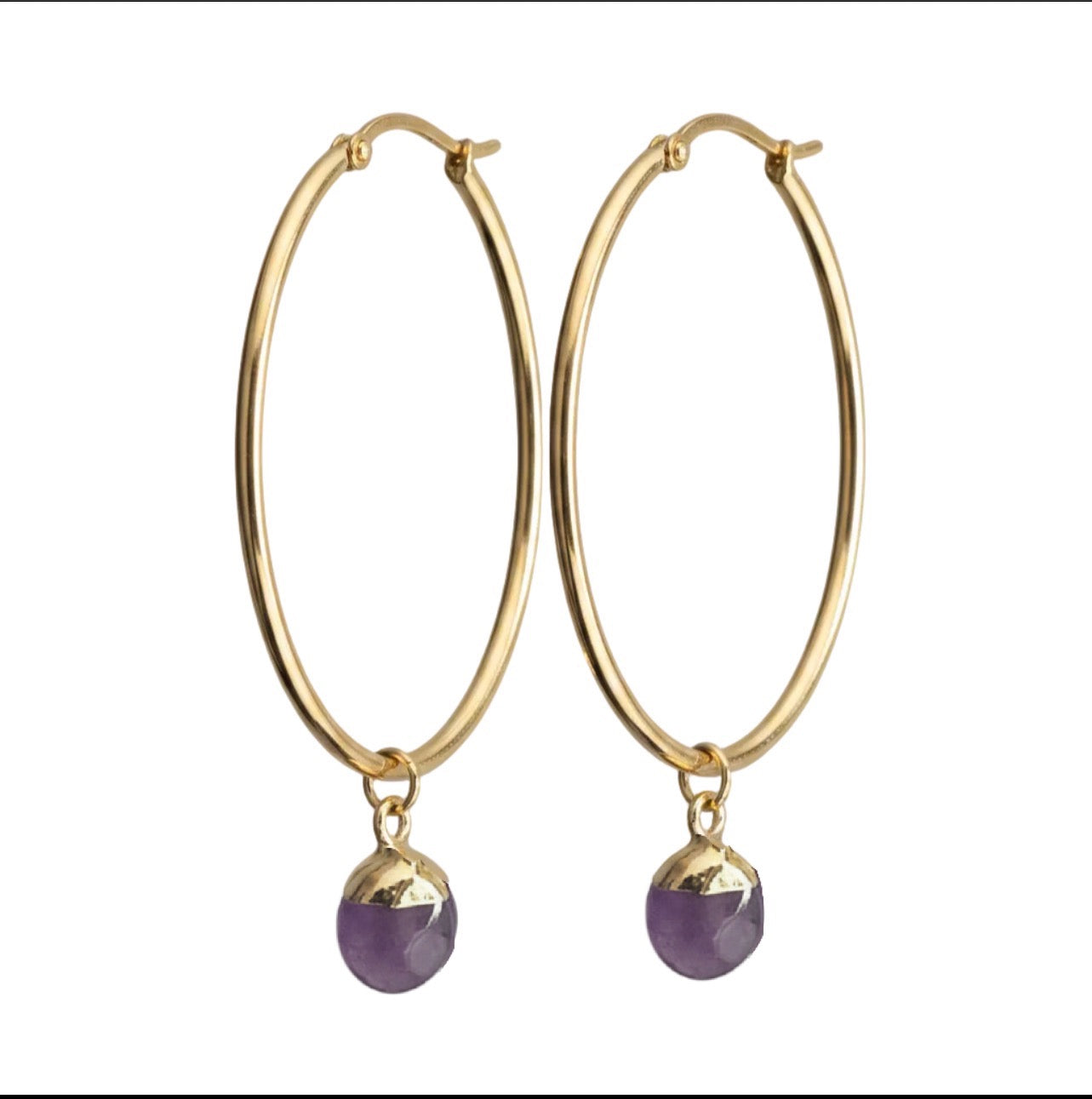 Gold hoop earrings with purple crystals on a white background