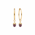 A pair of gold hoop earrings with dangling oval purple amethyst gemstone crystals shown against a plain white background.