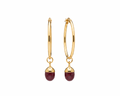 A pair of gold hoop earrings with small oval dark pink gemstone drops, shown on a plain white background.