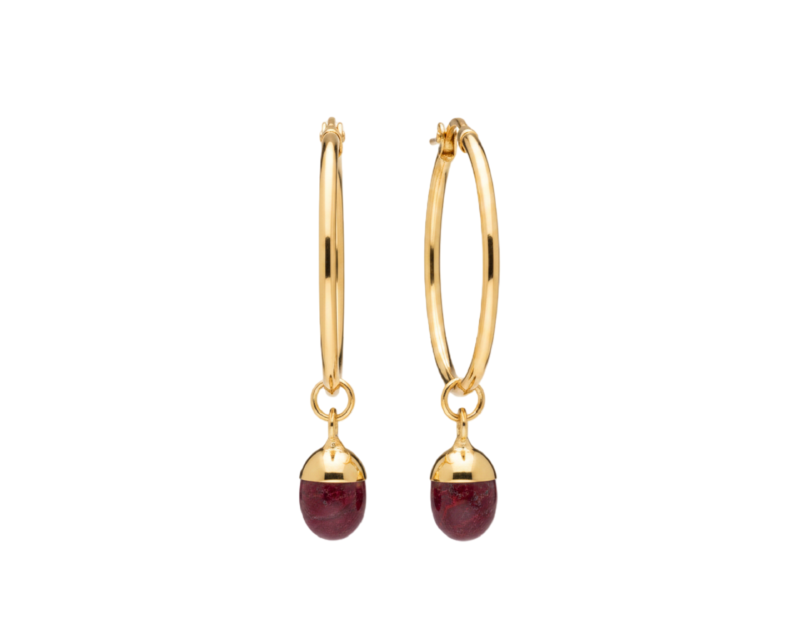 A pair of gold hoop earrings with small oval dark pink gemstone drops, shown on a plain white background.