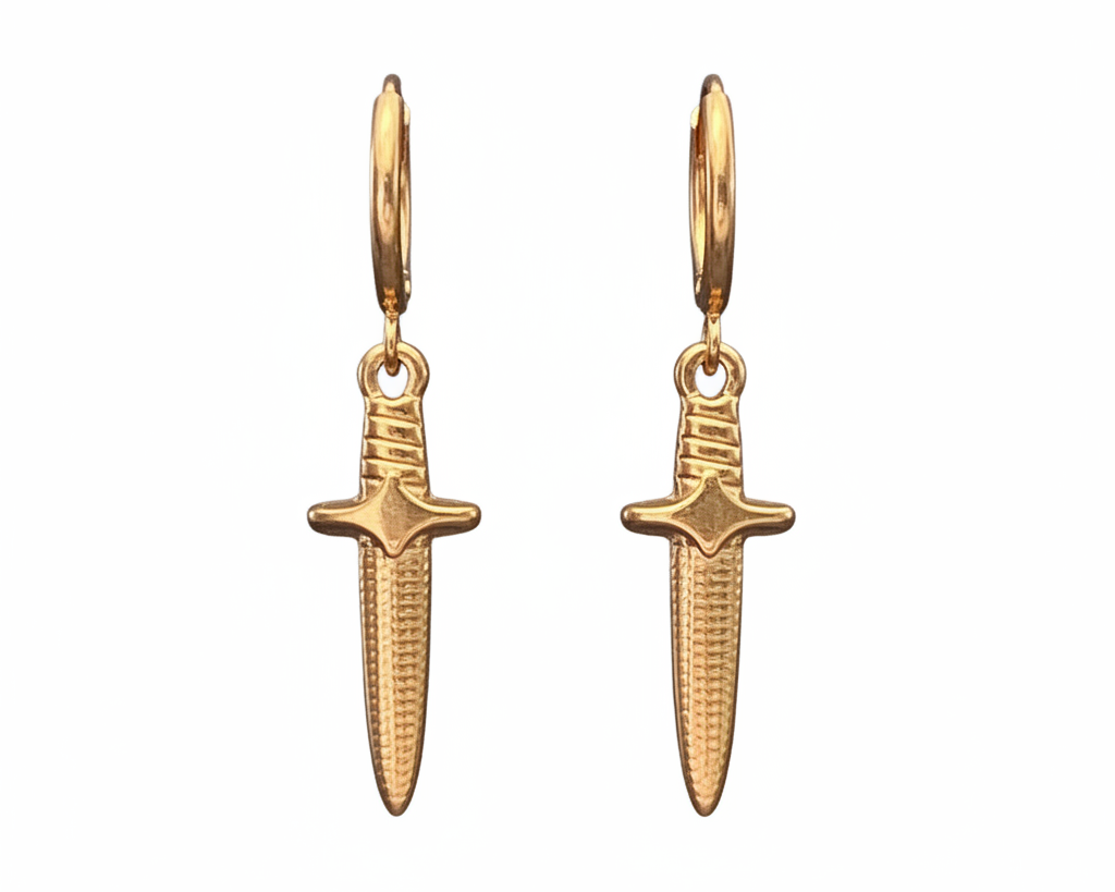 Gold dagger-shaped earrings on a white background