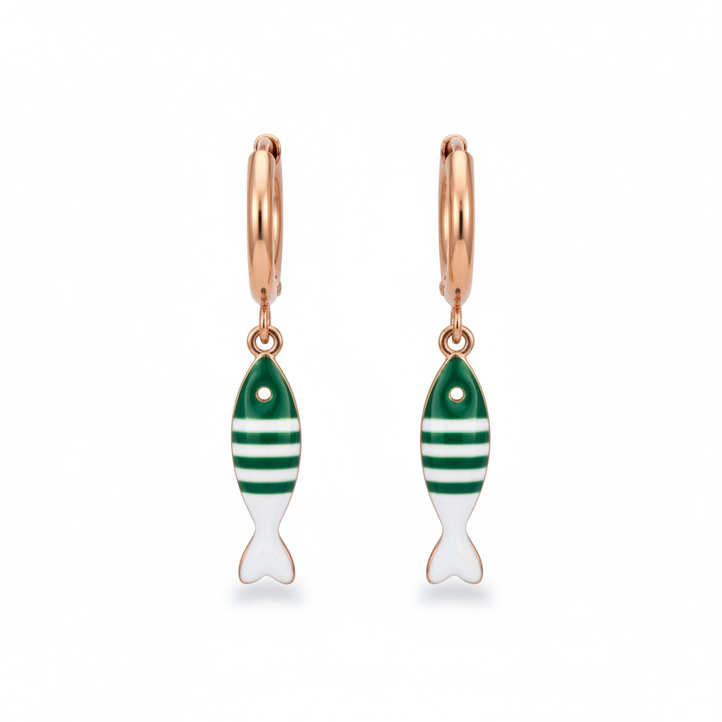 Gold hoop earrings with green and white fish charms on white background 