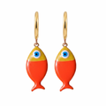 Pair of fish-shaped earrings with gold tops and orange bodies on a white background