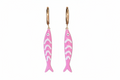 Pink fish-shaped earrings with gold hoops on a white background