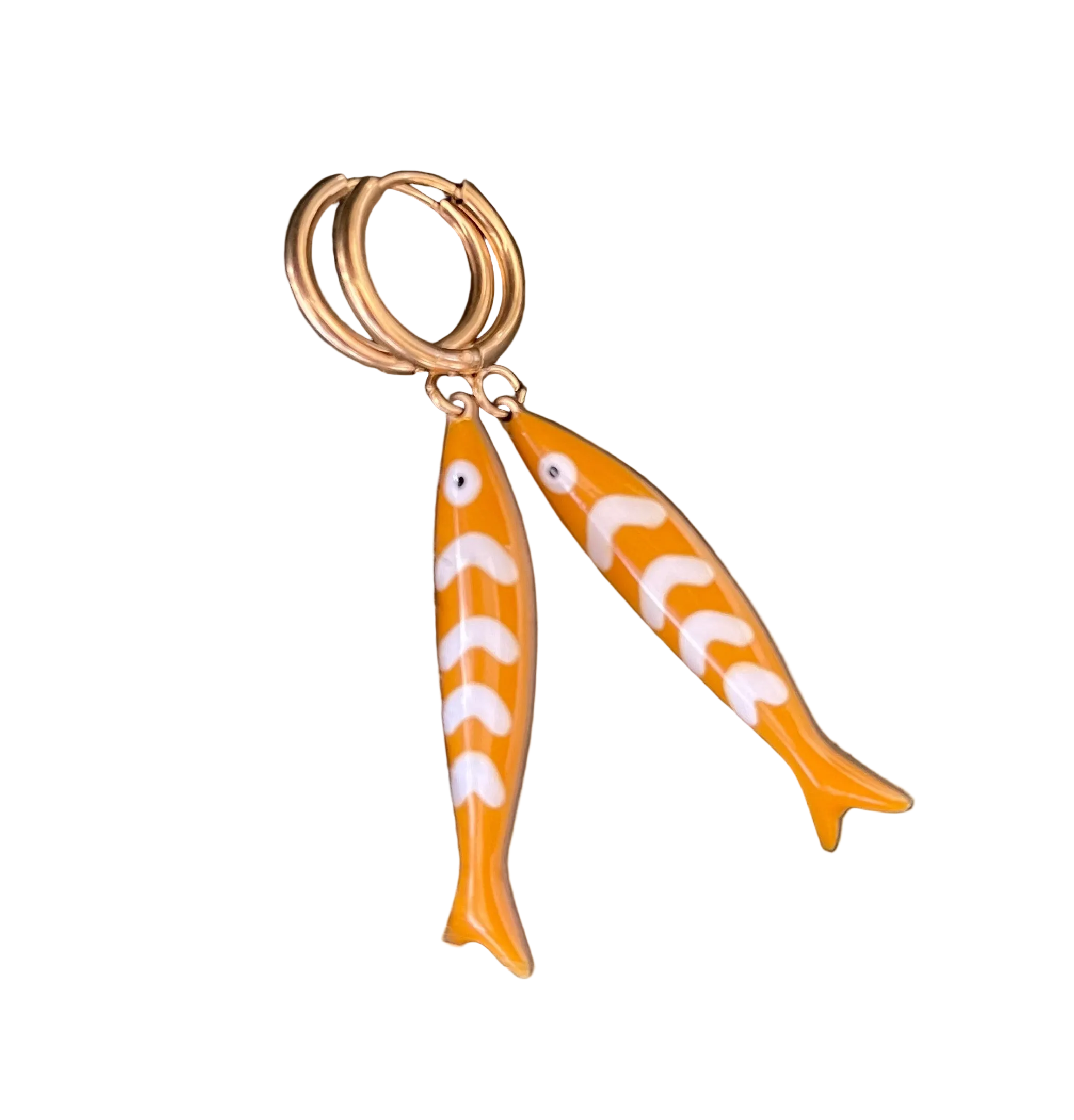 Gold hoop earrings with yellow and white fish-shaped charms on a white background