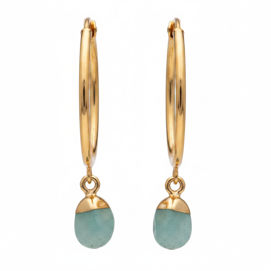 Gold hoop earrings with greenstone drops on a white background