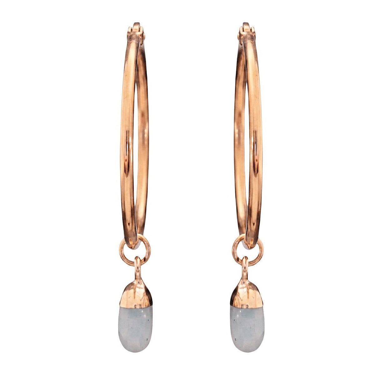 Gold hoop earrings with dangling opal crystals on a white background