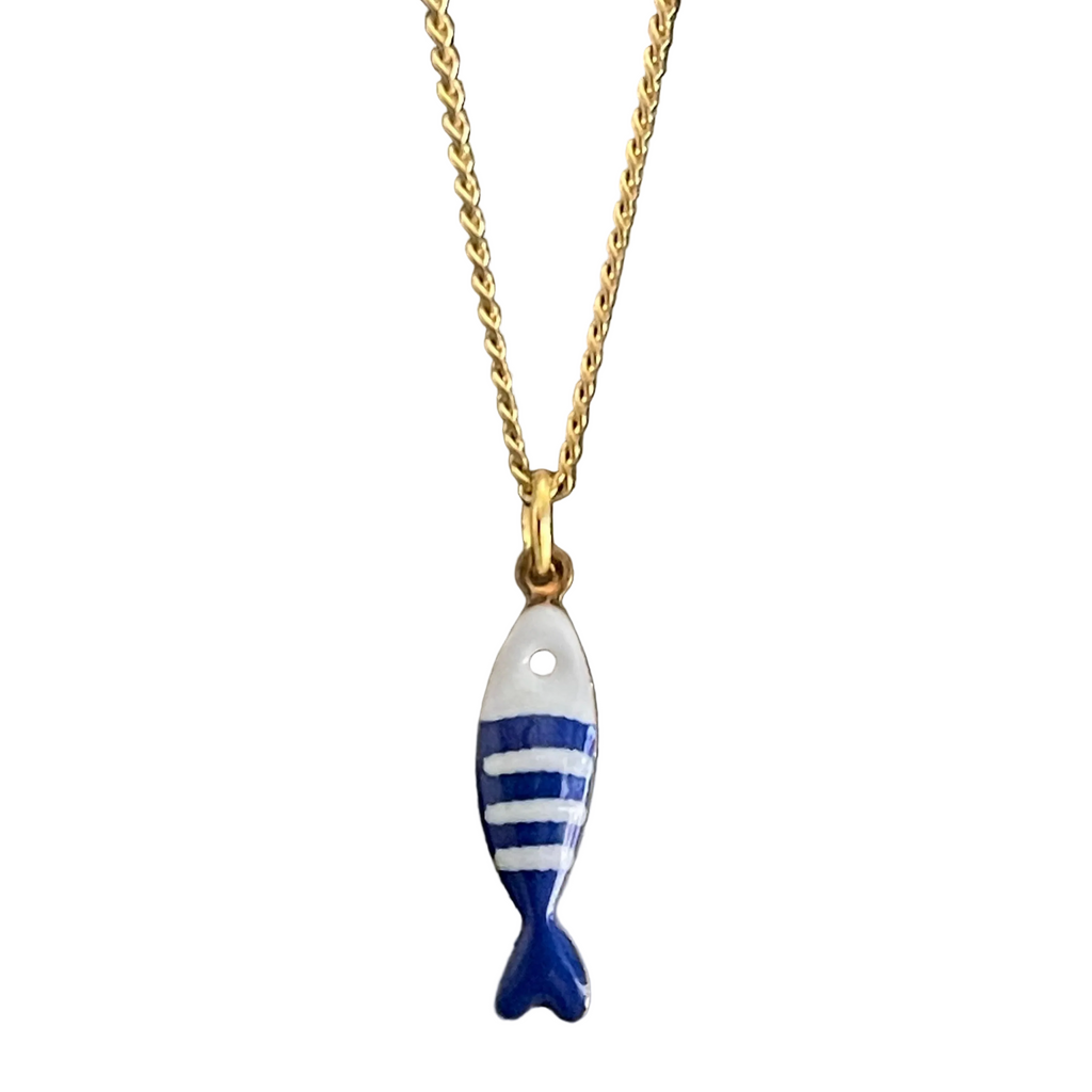Blue and white fish pendant on whit background 