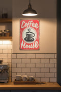Vintage-style 'Coffee House' sign with a red background and black and white text on a white kitchen wall