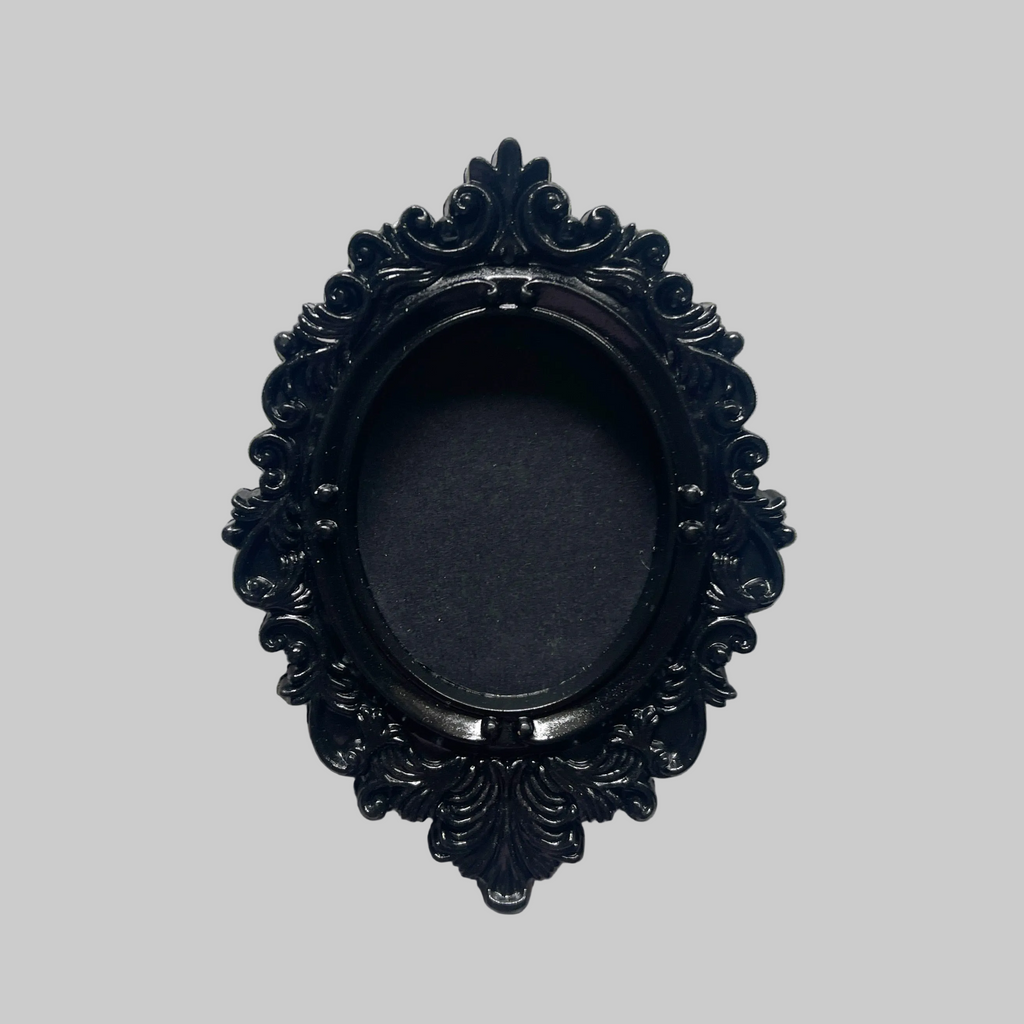 Decorative black oval frame on a gray background