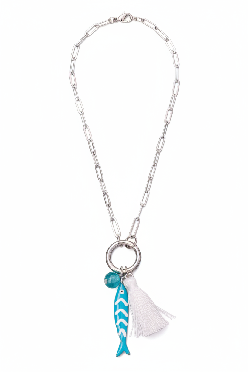 Necklace with fish charm and tassel on a white background
