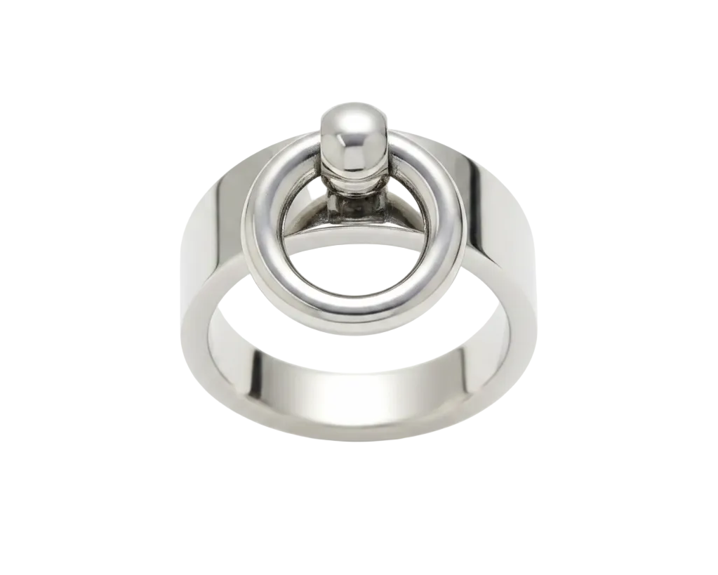 A polished silver-toned metal ring featuring a circular hoop with a small visible ball bearing mechanism, set against a plain white background.