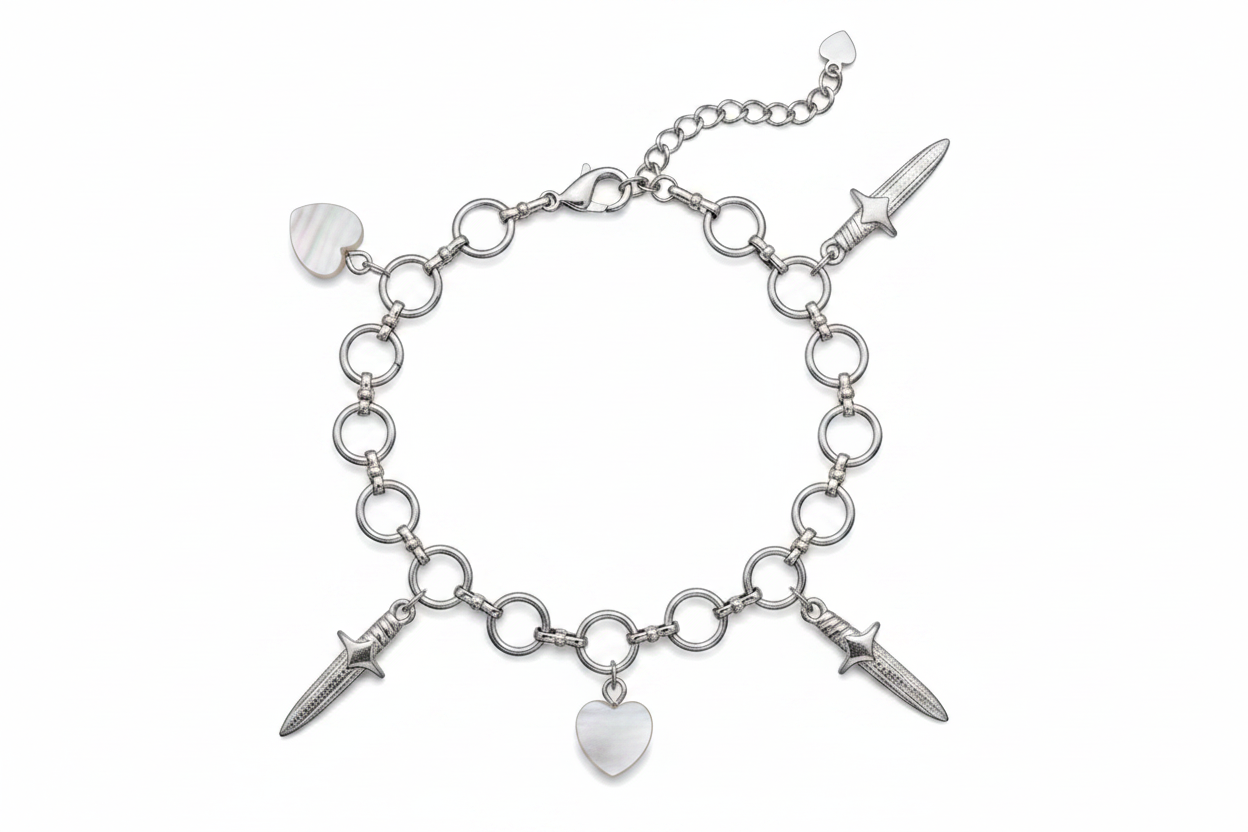 Silver bracelet with dagger and heart charms on a white background