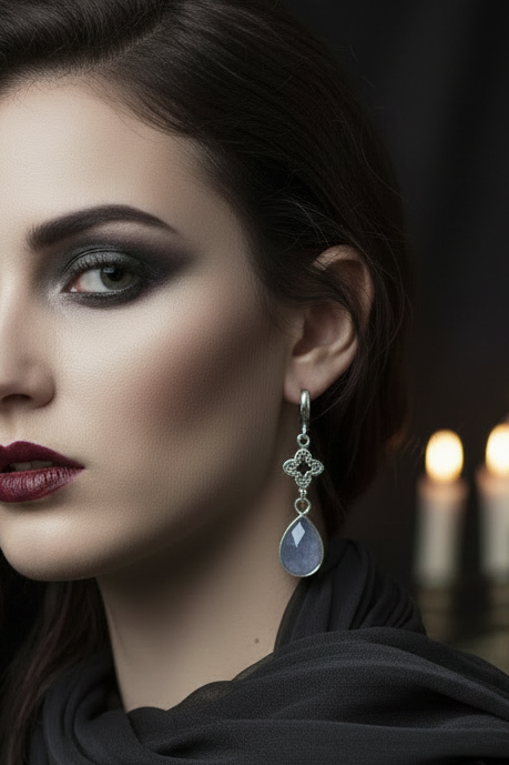 Close-up of a woman wearing an earring with a dark background