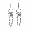 Silver earrings with chain and green crystals on a white background