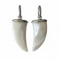 Pair of white horn-shaped earrings with silver hooks on a white background