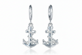 Silver anchor-shaped earrings on a white background