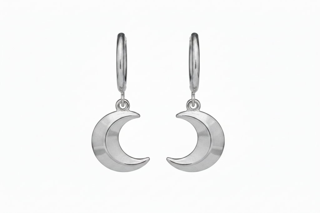 Silver moon-shaped earrings on a white background