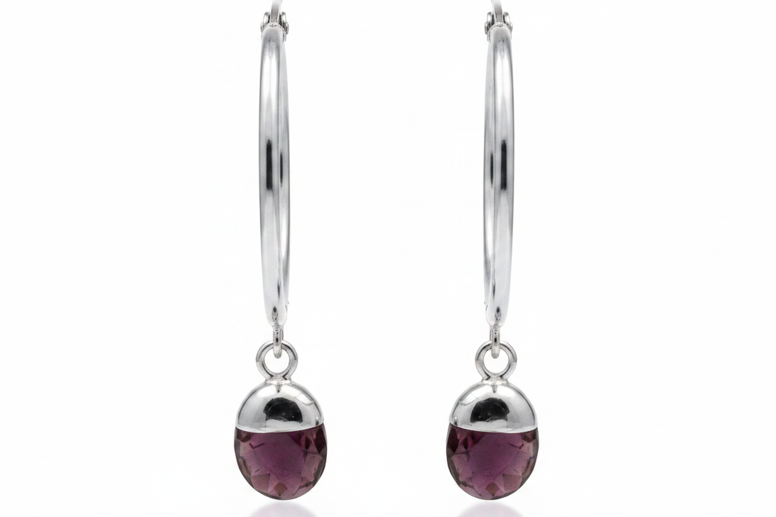 Silver hoop earrings with purple amethyst crystals on white background 