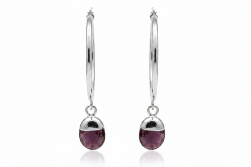 Silver hoop earrings with purple amethyst crystals on white background 
