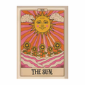A tarot card titled 'THE SUN.' with a stylized yellow sun face, pink and orange rays, clouds, sunflowers, and wavy pink ground on a cream card with a beige border.